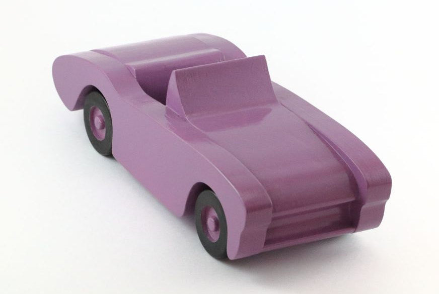 Handcrafted wooden toy car in purple
