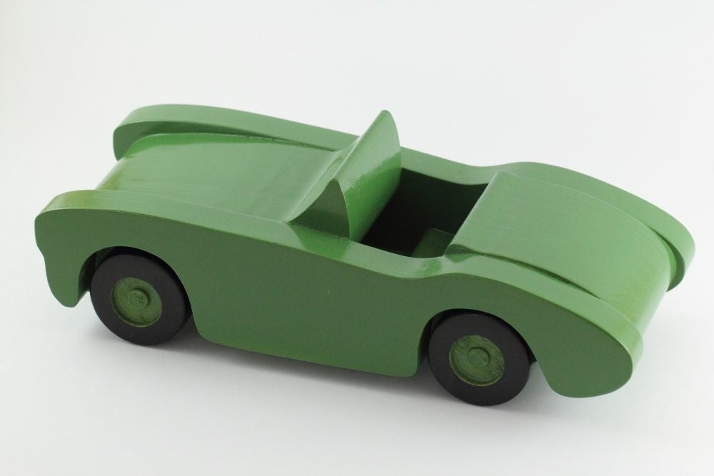 Handcrafted wooden toy car in green