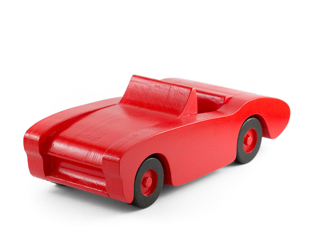 Handcrafted wooden toy car in red