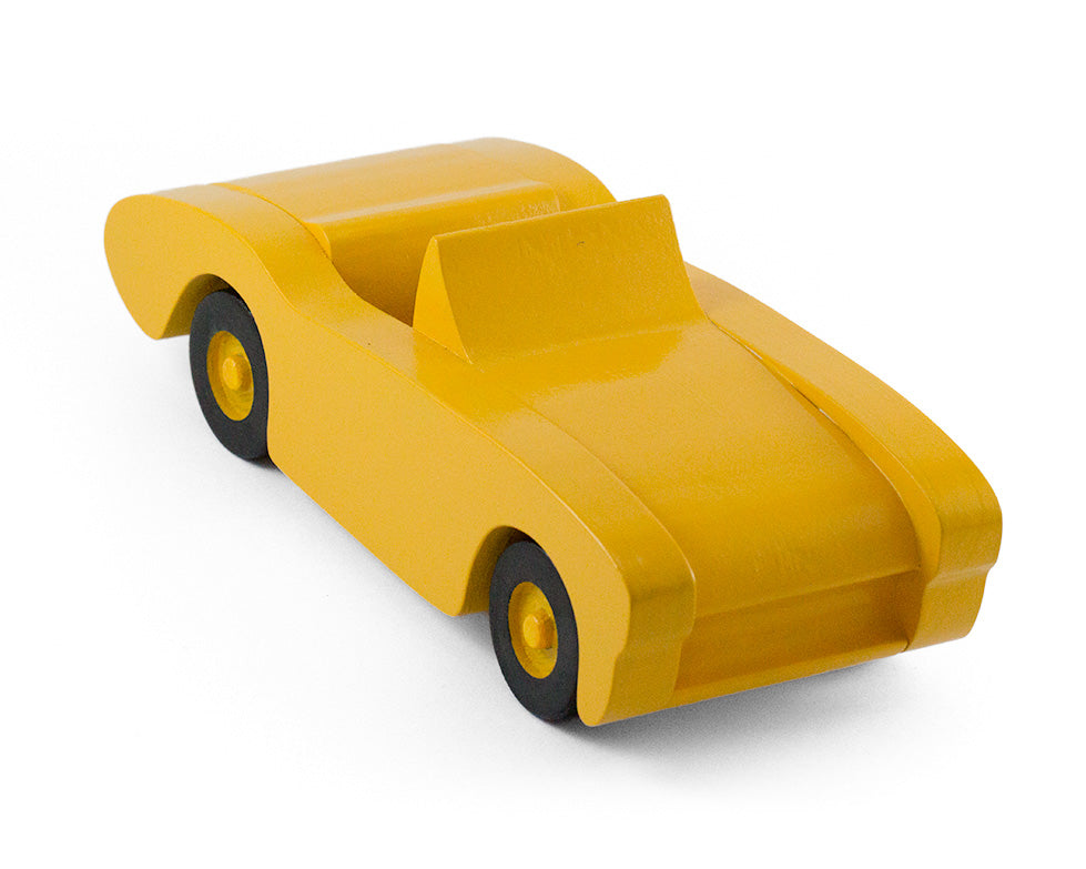 Handcrafted wooden toy car in yellow